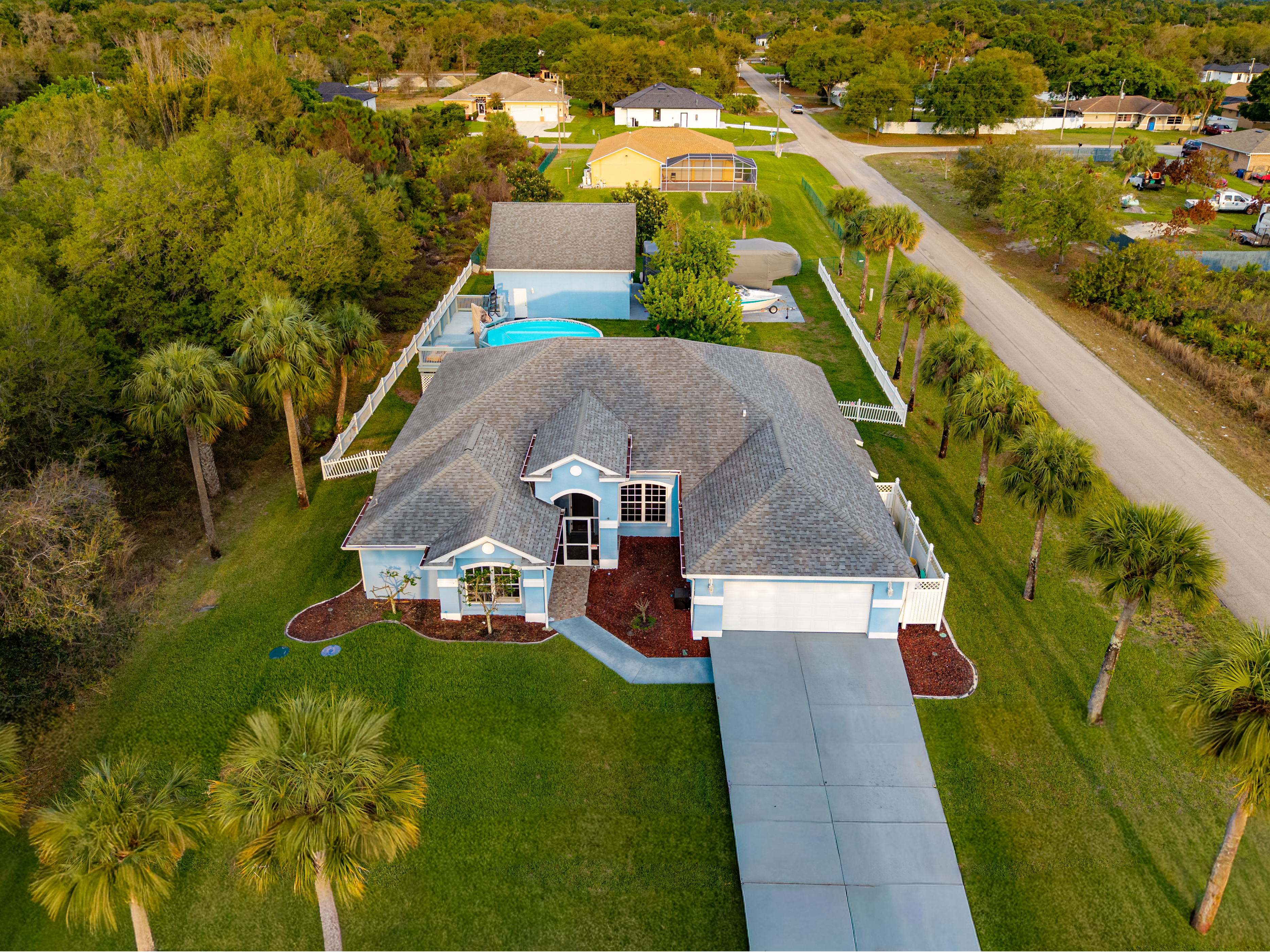 Large aerial composition of estate and surrounding greenery